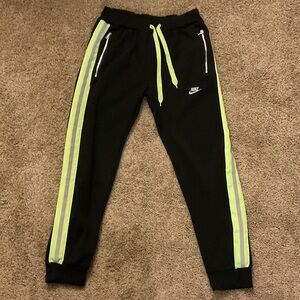 Nike Black Joggers with Neon Yellow Side Stripes